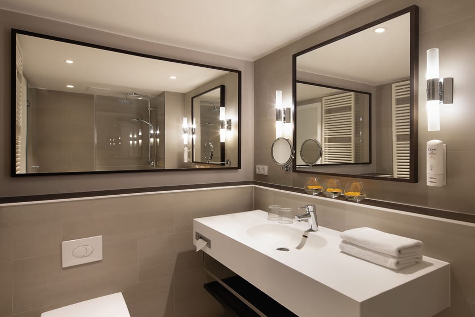 Rainfall showerhead, eco-friendly toiletries, hair dryer, towels