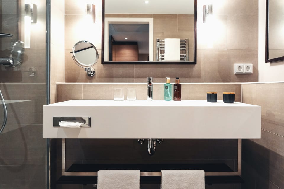 Rainfall showerhead, eco-friendly toiletries, hair dryer, towels