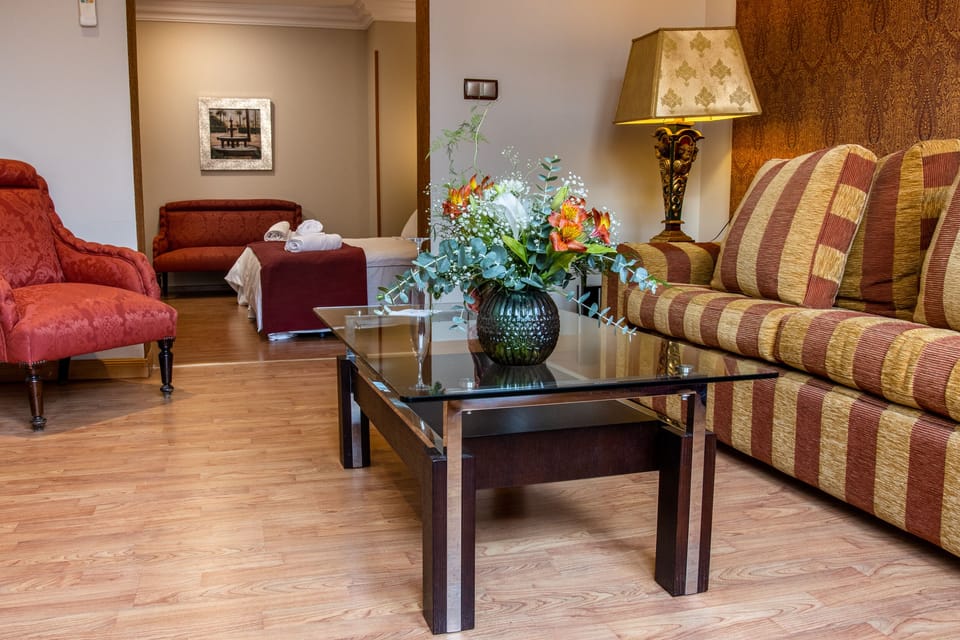 Superior Suite | Living room | Flat-screen TV