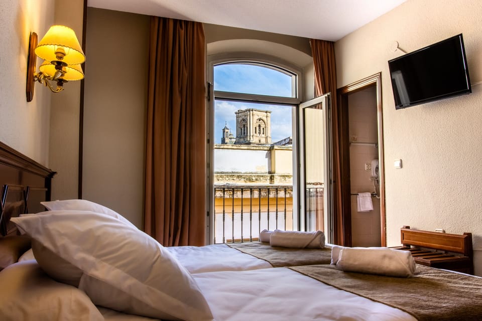 Standard Double Room | Minibar, in-room safe, desk, laptop workspace