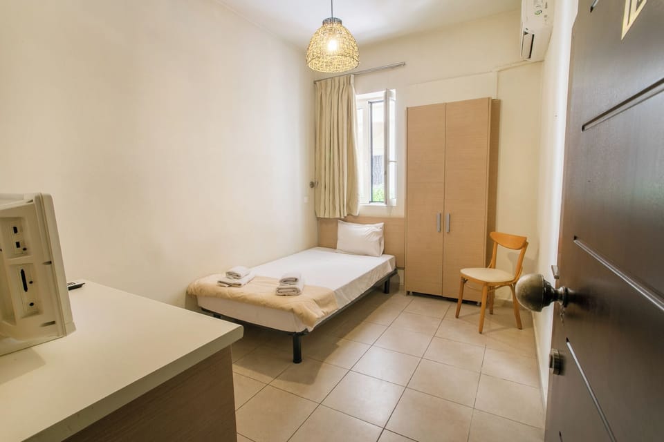 Economy Single Room, 1 Twin Bed | In-room safe, iron/ironing board, free WiFi, bed sheets