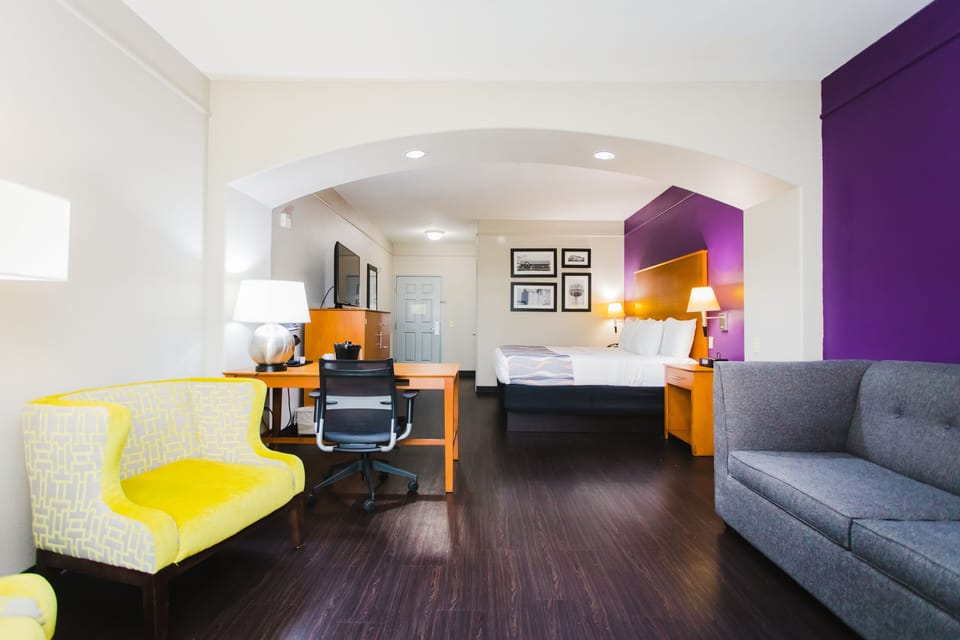 Premium bedding, desk, laptop workspace, iron/ironing board