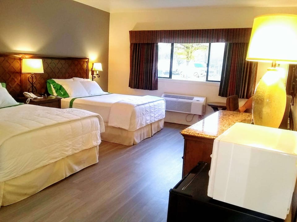 Premium bedding, desk, laptop workspace, blackout drapes