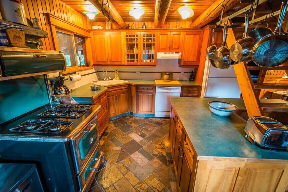 Kitchen fully equipped: dishwasher, microwave, coffee maker, blender & toaster. Using a blend of beautiful cherry, cedar and pine wood, this highly modern country kitchen is for the serious holiday chef.  New Heartland propane stove. Washer & Dryer; Central Vacuum - you're on vacation!