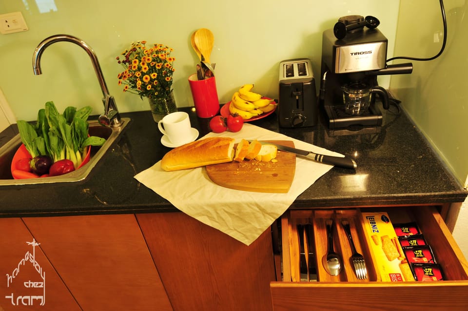 kitchenette with coffee machine, toaster, kitchenware, dishes and utensils