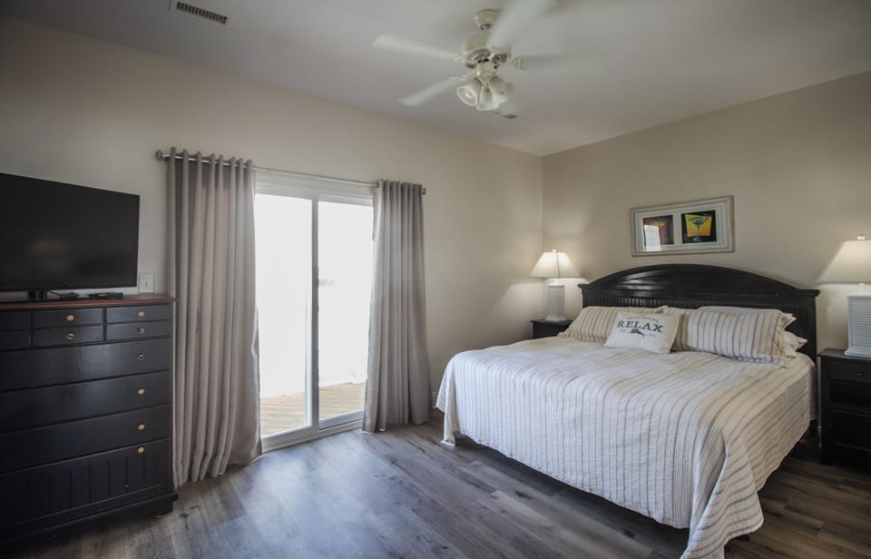 3rd floor master bedroom opposite the kitchen/living area which looks over ocean
