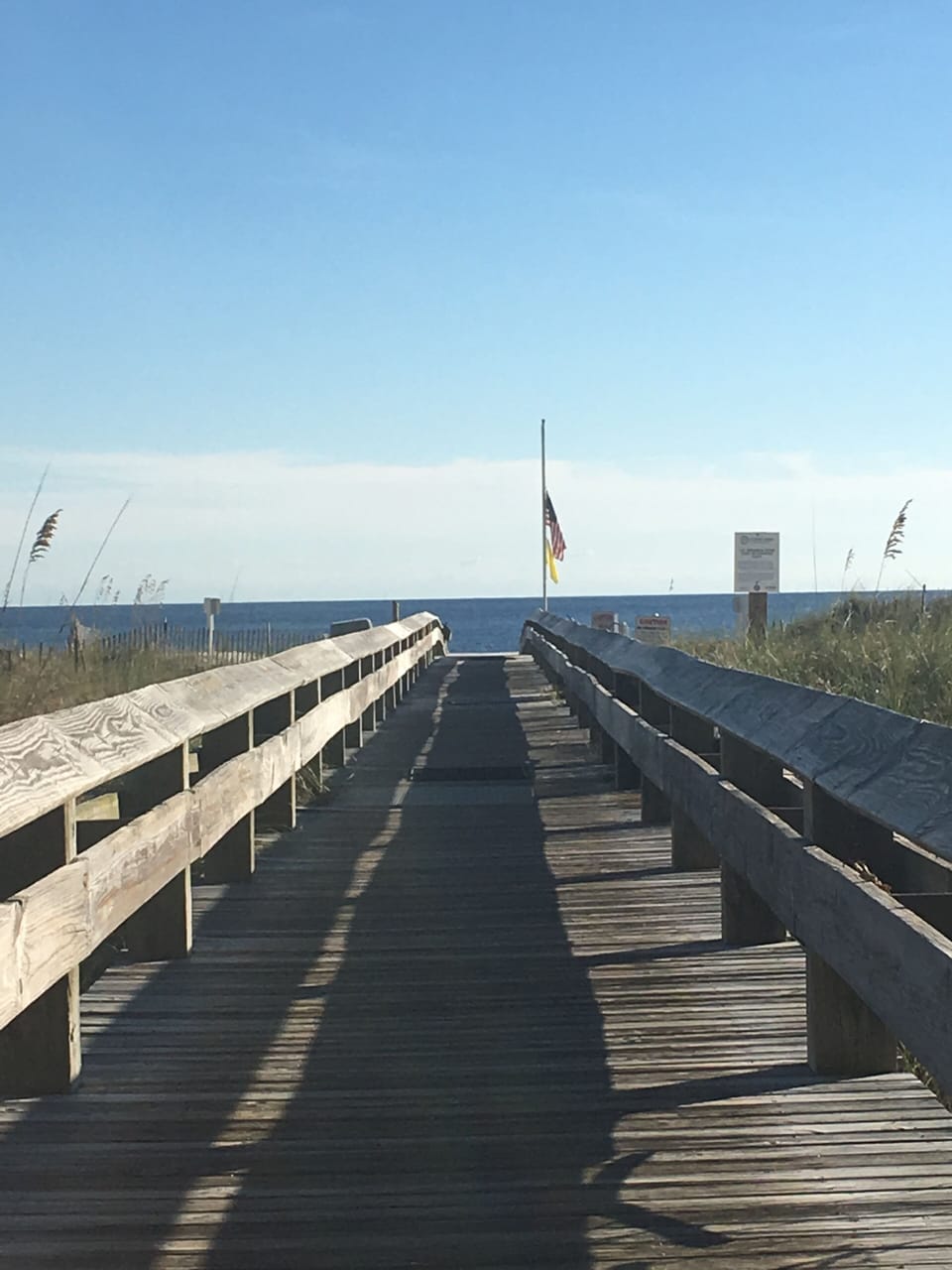 Boardwalk off pool area to beach.