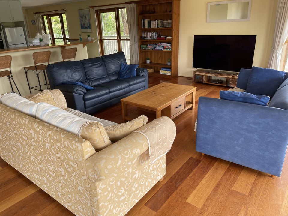 And the living room also has a 65 inch flatscreen TV and DVD