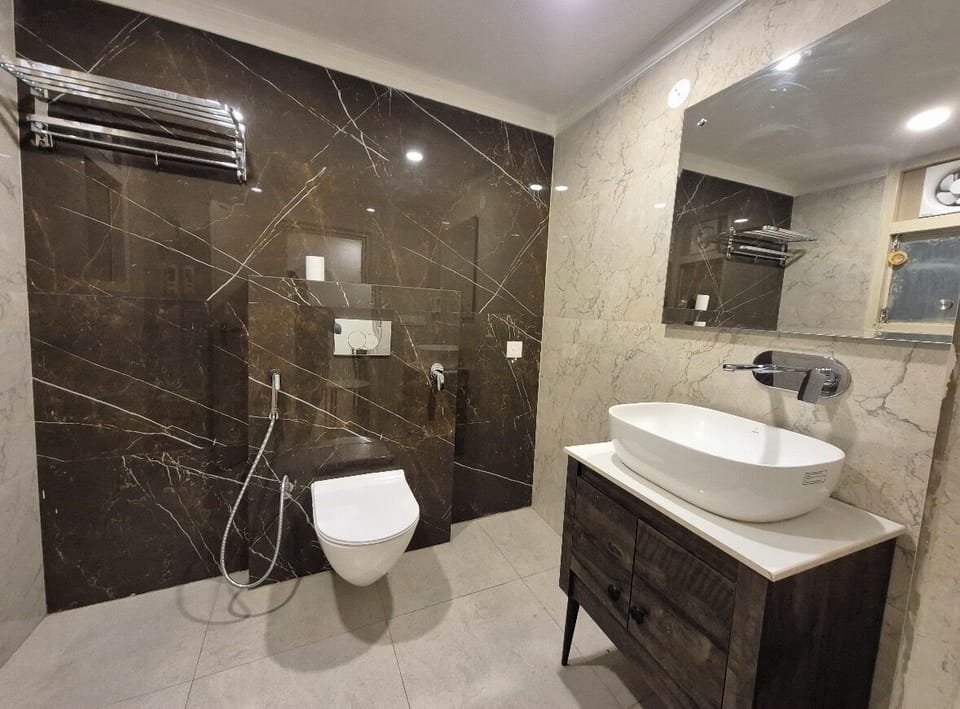 Shower, rainfall showerhead, designer toiletries, towels