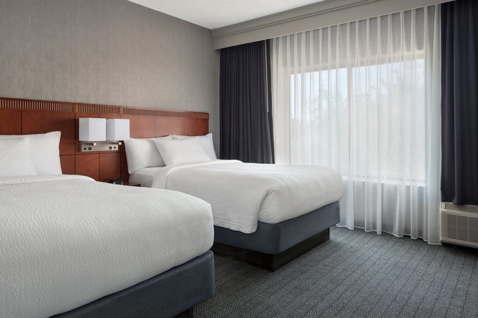 Premium bedding, desk, laptop workspace, iron/ironing board