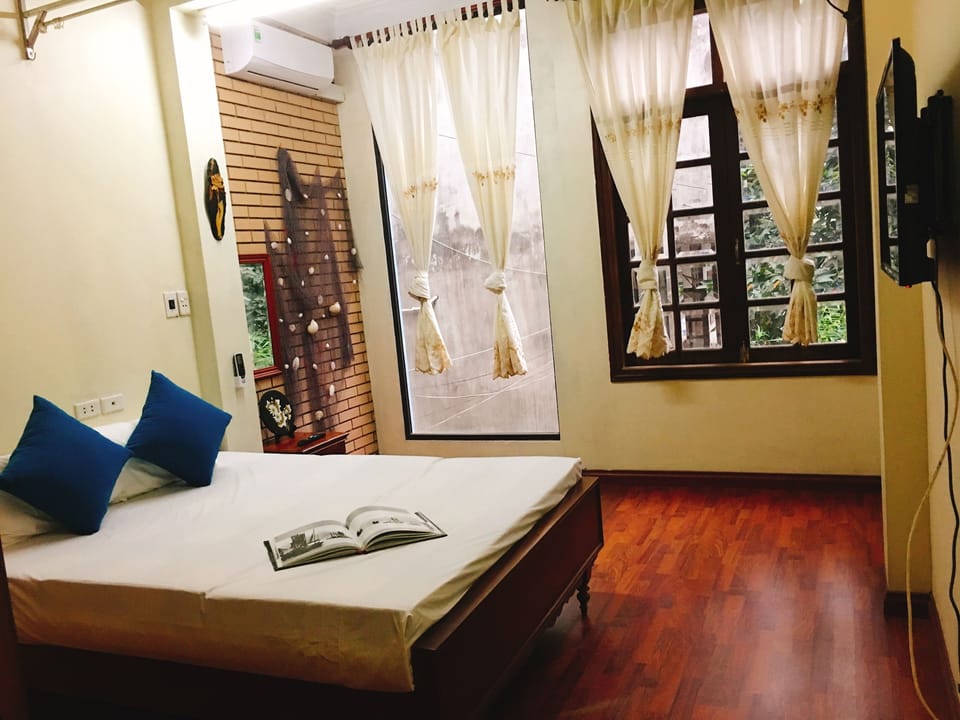 Deluxe Double Room, Garden View | Desk, blackout drapes, iron/ironing board, free WiFi