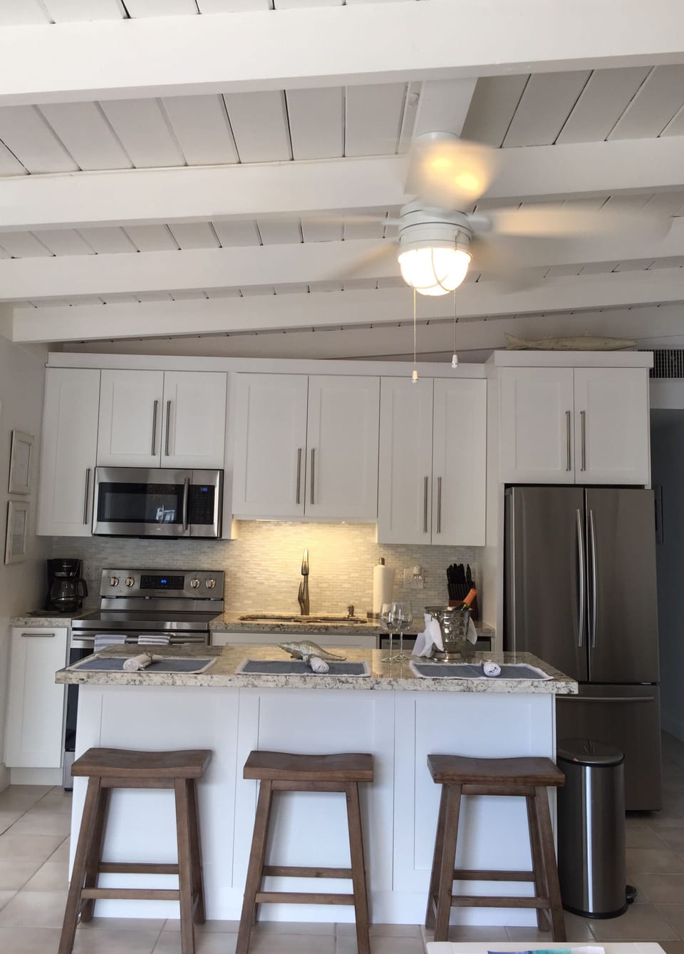 Kitchen island, perfect for prepping meals, view to canal & tropical backyard.