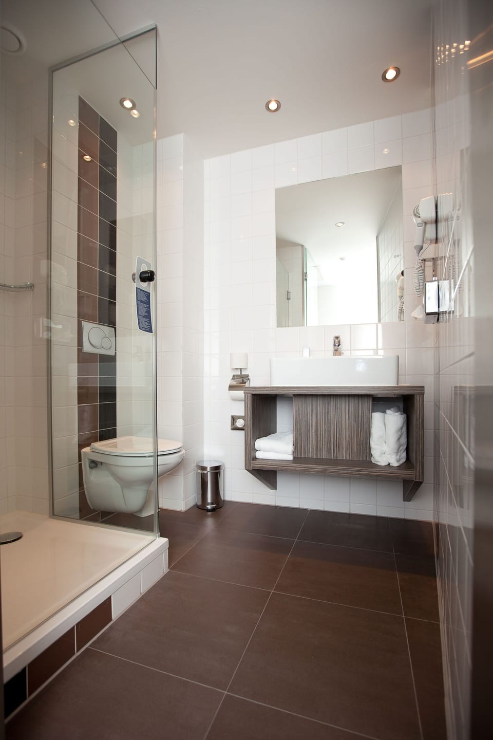 Shower, rainfall showerhead, hair dryer, towels