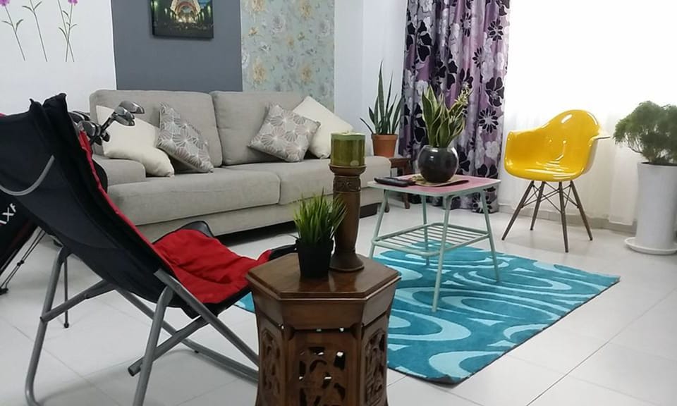 Apartment, 4 Bedrooms | Living room | Flat-screen TV