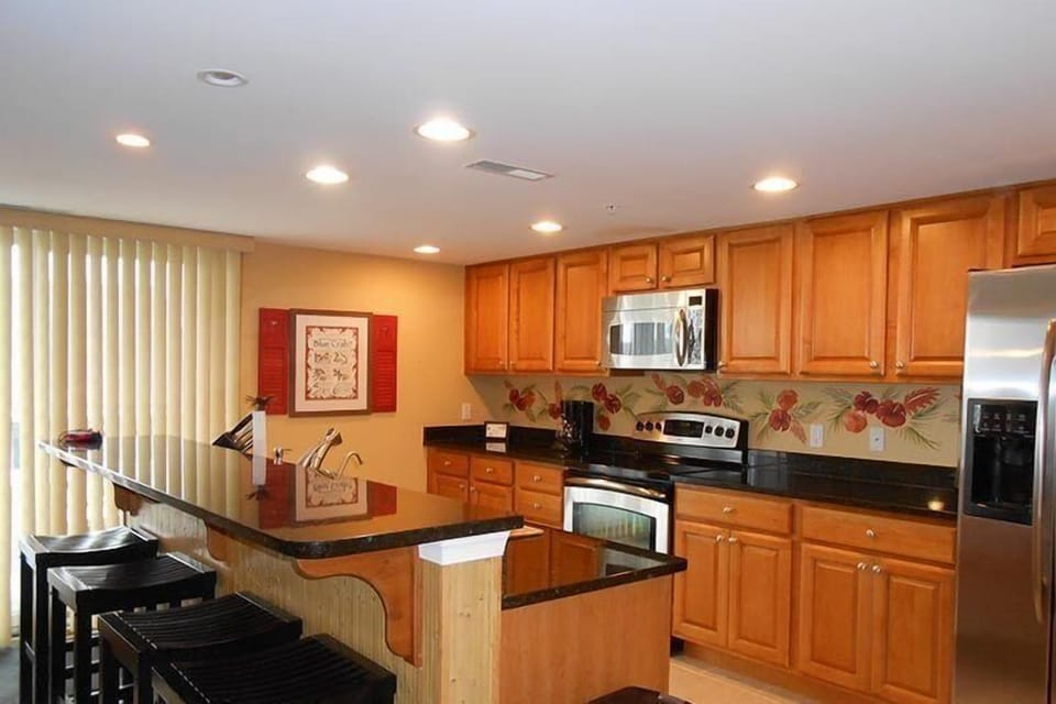 Condo, 4 Bedrooms | Private kitchen | Fridge, microwave, dishwasher, coffee/tea maker
