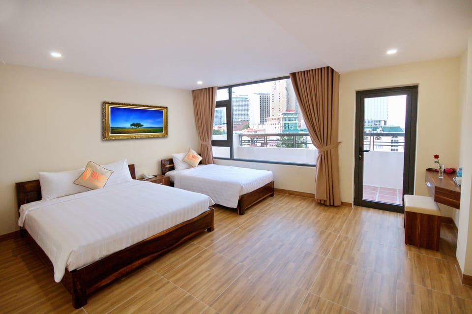 Deluxe Triple Room | Minibar, in-room safe, desk, soundproofing