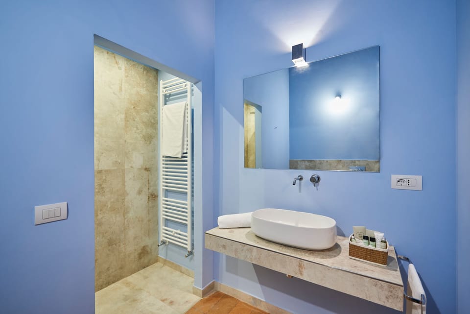 Standard Suite | Bathroom | Shower, deep soaking tub, free toiletries, bathrobes