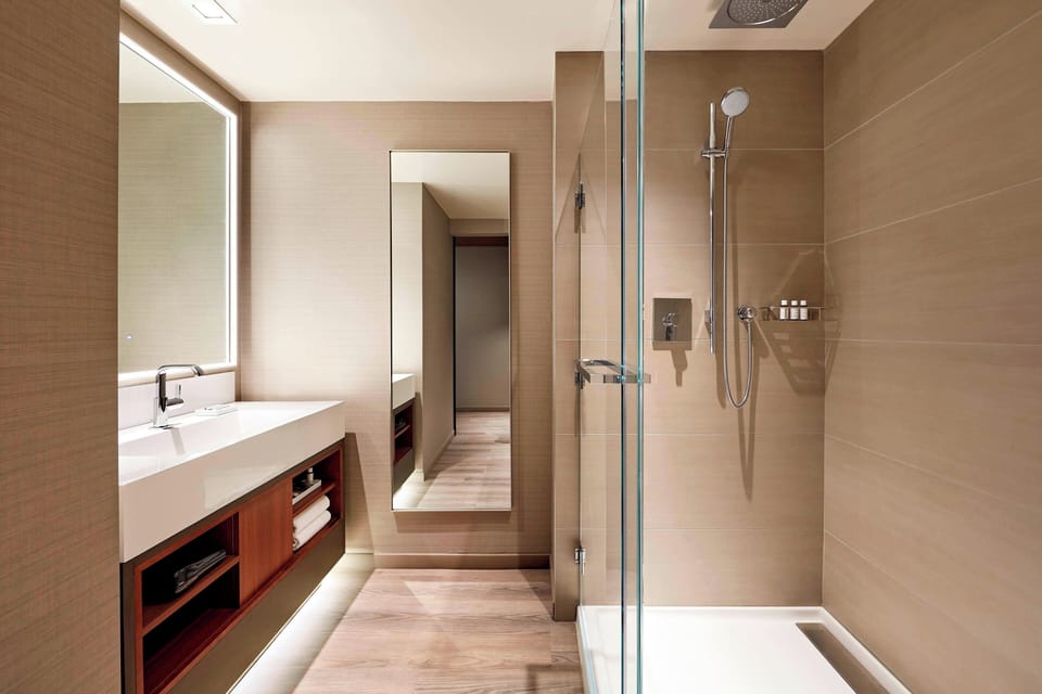 Combined shower/tub, designer toiletries, hair dryer, bathrobes