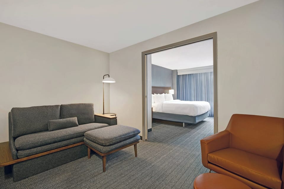 Superior Suite, 1 Bedroom, Hearing Accessible | Desk, laptop workspace, blackout drapes, iron/ironing board