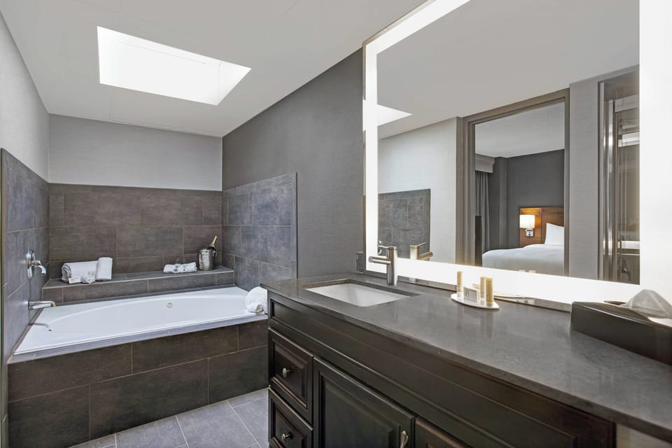 Superior Suite, 1 Bedroom, Hearing Accessible | Bathroom | Combined shower/tub, eco-friendly toiletries, hair dryer, towels