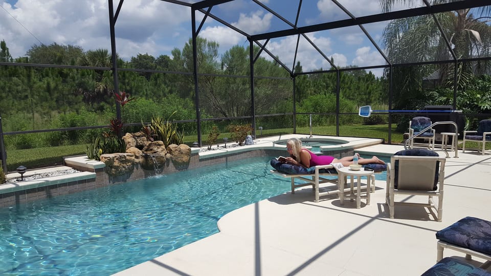 Large Pool Enclosure & Cushioned Pool Furnishings