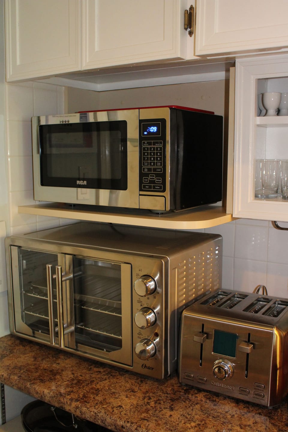 Brand new large convection toaster oven, microwave and four slice toaster. 
