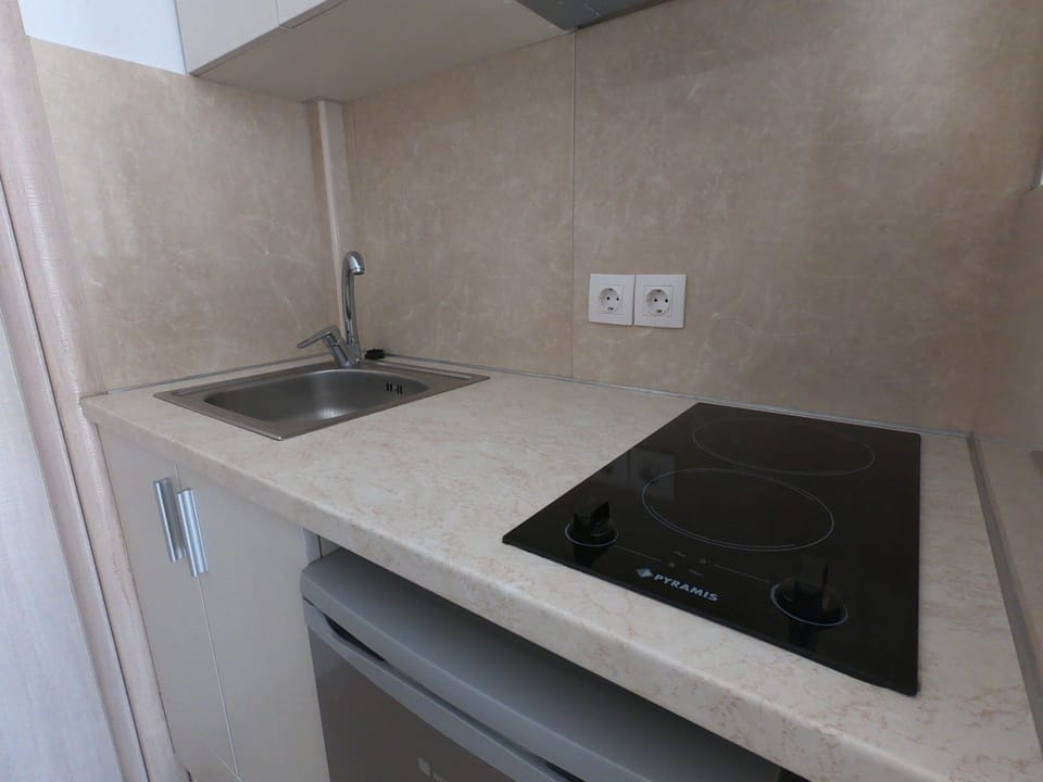 Fridge, coffee/tea maker, electric kettle, cookware/dishes/utensils