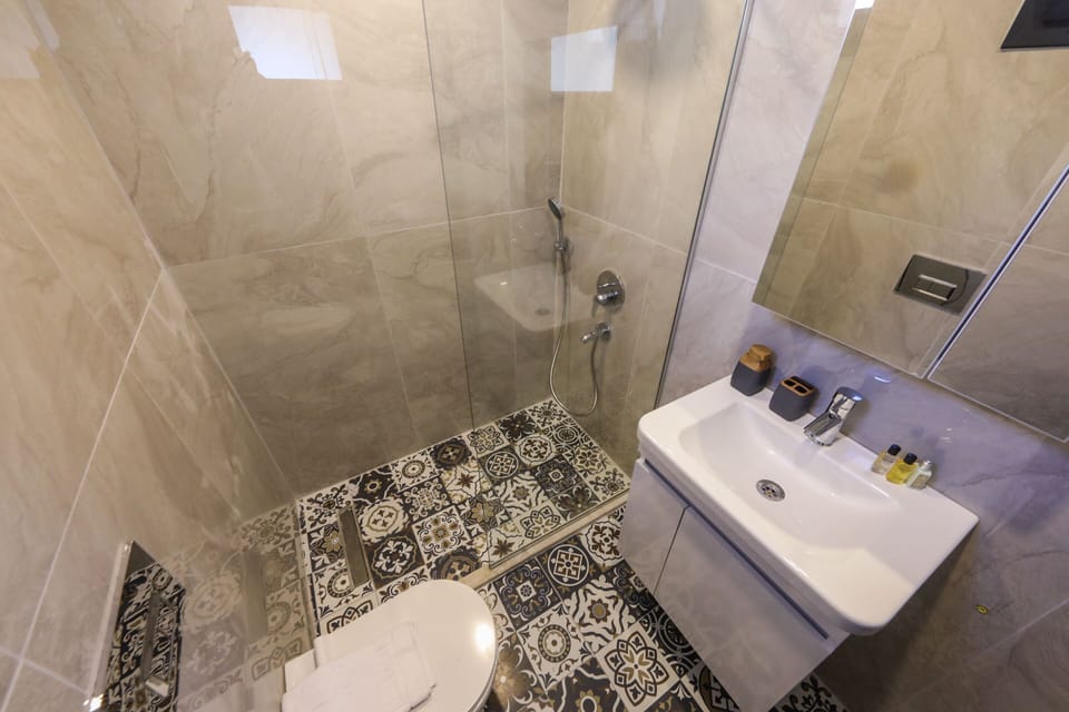 Junior Suite, Terrace | Bathroom | Shower, free toiletries, hair dryer, slippers