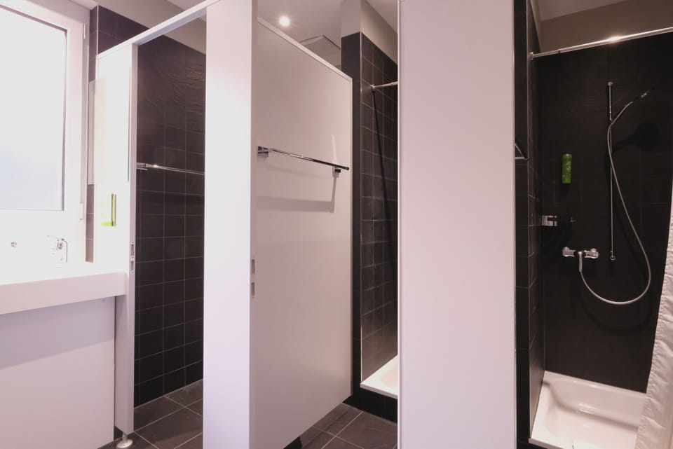 Shower, eco-friendly toiletries, hair dryer, towels