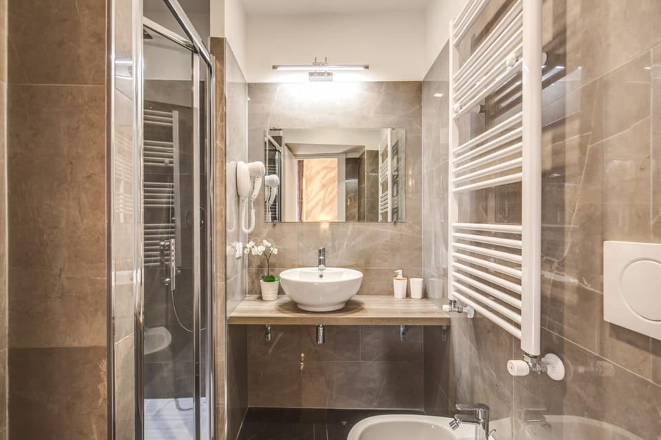 Shower, free toiletries, hair dryer, slippers