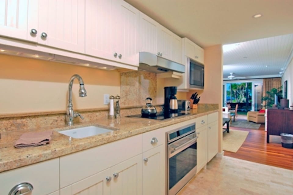 Ocean view gourmet kitchen in master suite! - Wolf appliances, Subzero under counter fridge with freezer and ice maker.