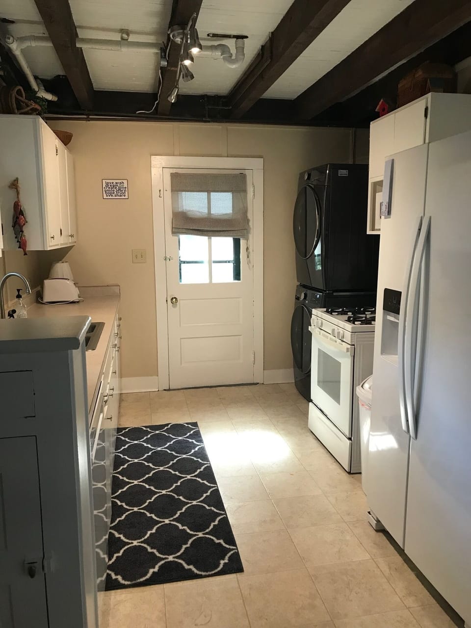 Full-sized washer/dryer featured here
