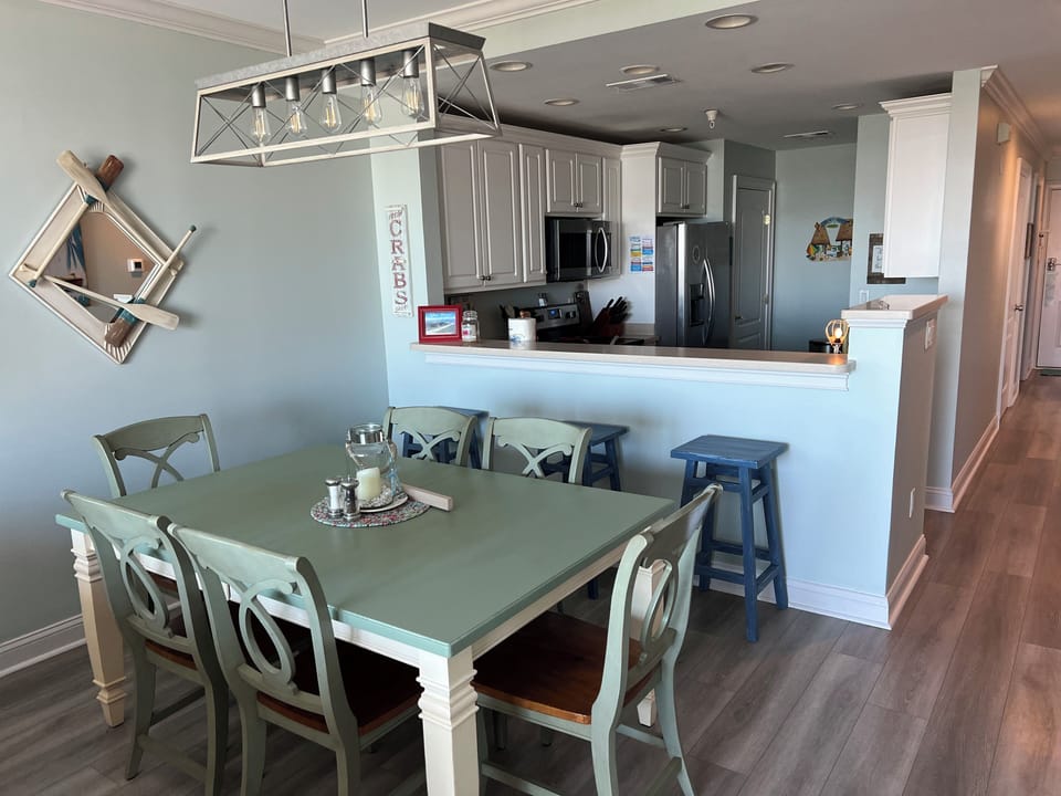 Dining area looking into the kitchen! Table seats 6 and there are 3 bar stools!