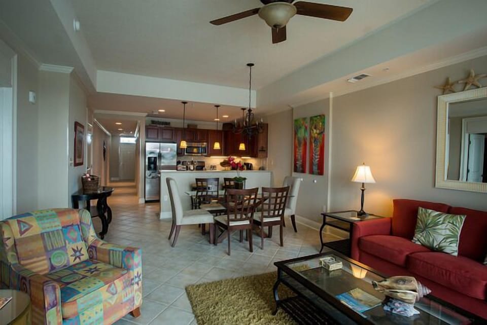 This is a long view of the living and dining rooms from the patio sliding door.