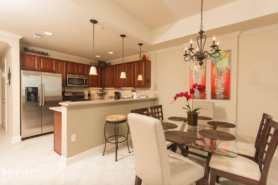The dining room and kitchen. Dining room table seats 6; breakfast bar seats 2.