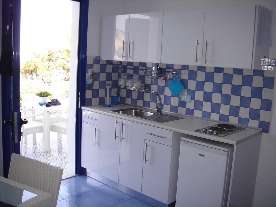 Fridge, stovetop, espresso maker, coffee/tea maker