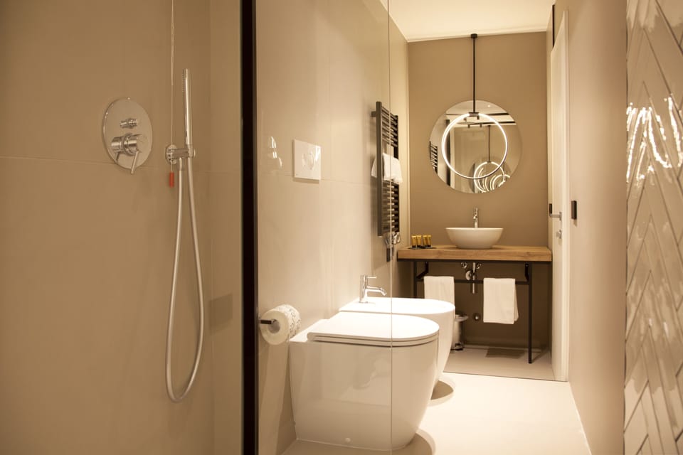 Suite, 1 Queen Bed with Sofa bed, Balcony | Bathroom | Shower, free toiletries, hair dryer, bathrobes
