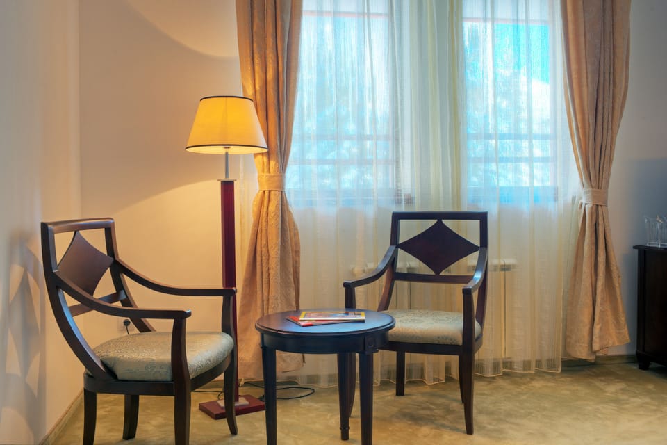Apartment, 1 Bedroom | Minibar, desk, blackout drapes, iron/ironing board