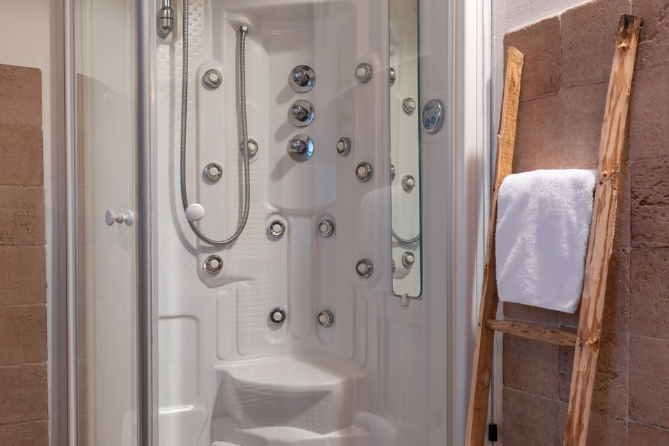 Shower, free toiletries, hair dryer, slippers