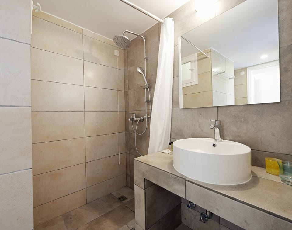 Family Suite, 2 Bedrooms (Side View) | Bathroom | Shower, free toiletries, hair dryer, towels