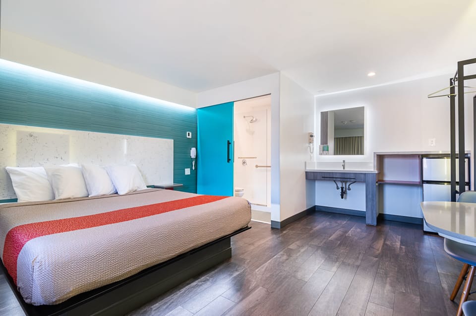 Room, 1 King Bed | In-room safe, desk, blackout drapes, iron/ironing board