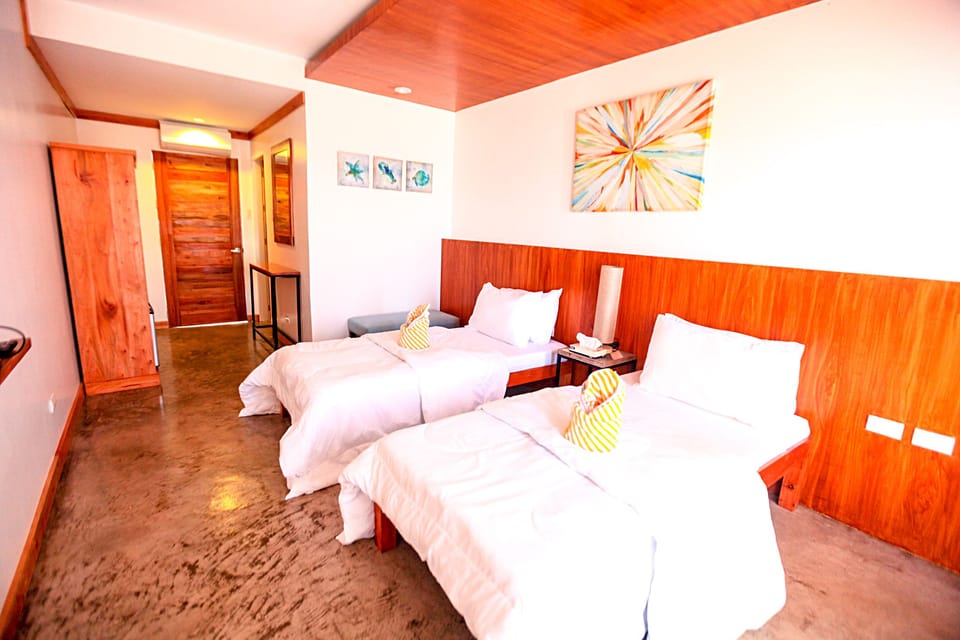 Seaview Room | Minibar, in-room safe, iron/ironing board, free cribs/infant beds
