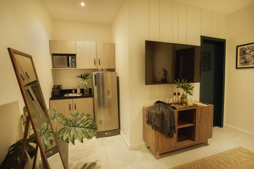 Family Room with Balcony | Private kitchen | Coffee/tea maker, electric kettle
