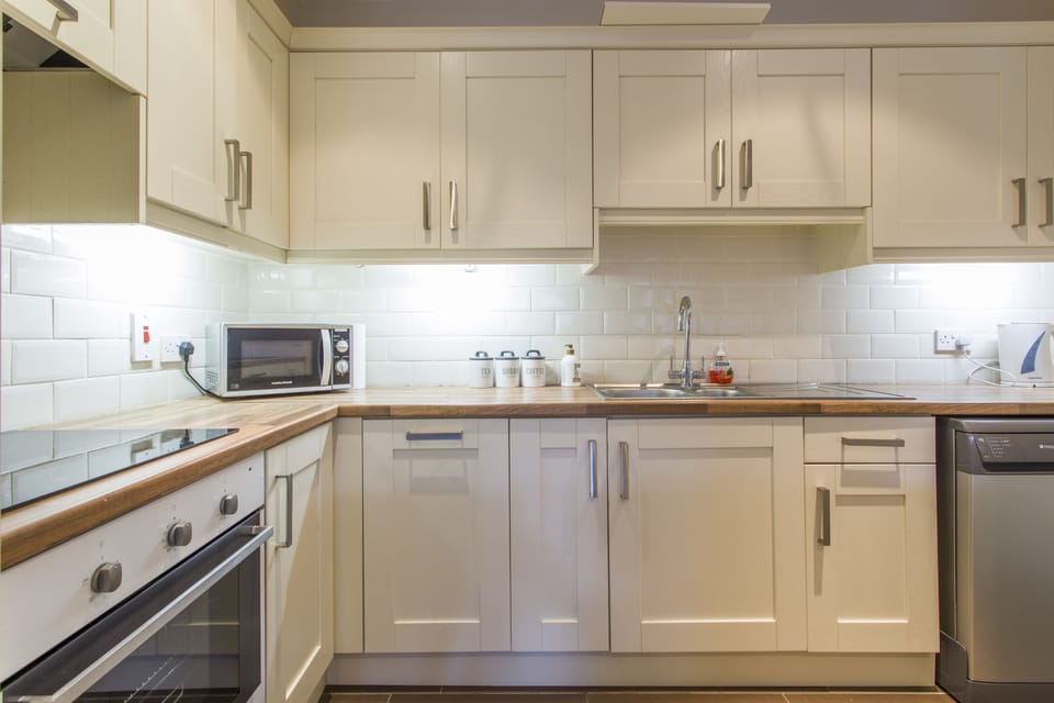 Basic Apartment, 2 Bedrooms | Private kitchen | Fridge, microwave, stovetop, dishwasher