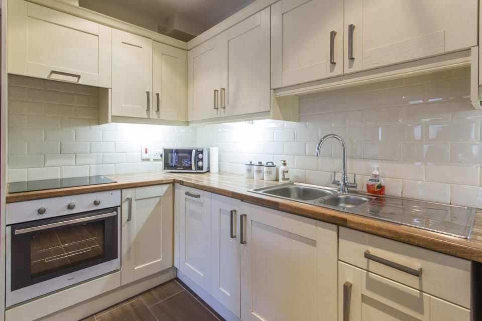 Basic Apartment, 2 Bedrooms | Private kitchen | Fridge, microwave, stovetop, dishwasher