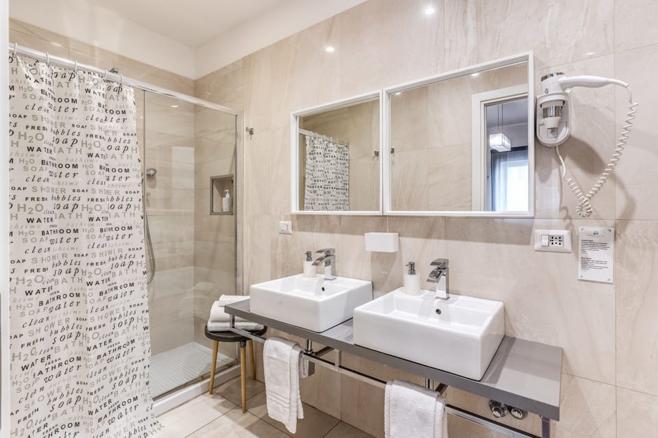 Junior Suite, 1 Bedroom, Ensuite, Partial Sea View | Bathroom | Shower, rainfall showerhead, free toiletries, hair dryer