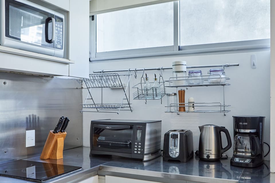 Apartment, 2 Bedrooms | Private kitchen | Fridge, microwave, stovetop, coffee/tea maker