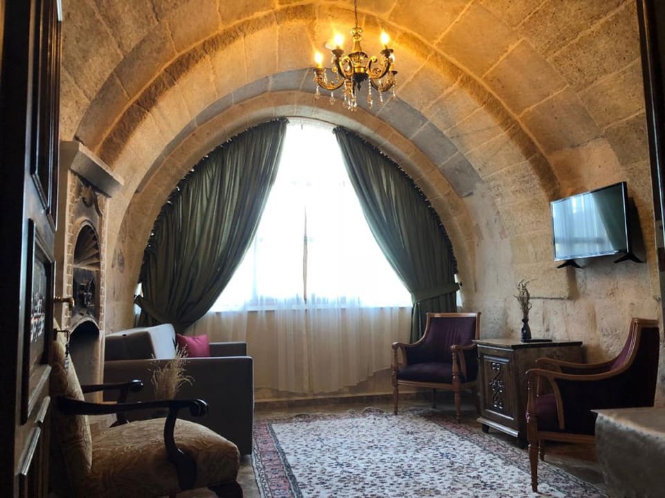 Suite, 1 Bedroom | Living area | 82-cm LCD TV with satellite channels, TV, heated floors