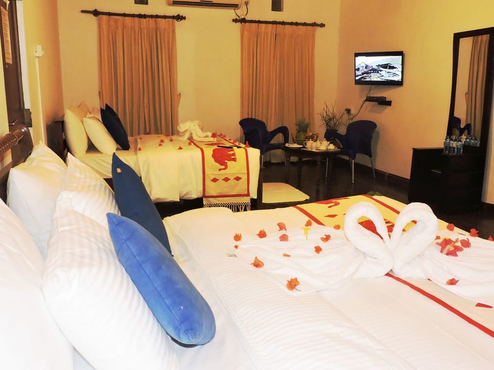 Standard Quadruple Room, 2 Double Beds, Private Bathroom, Garden View | Minibar, in-room safe, desk, soundproofing