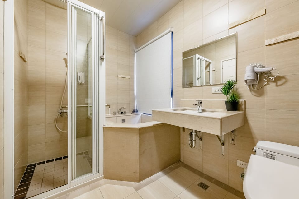 Deluxe Quadruple Room, 1 Bedroom, Non Smoking, Bathtub | Bathroom | Hair dryer, slippers, bidet, towels